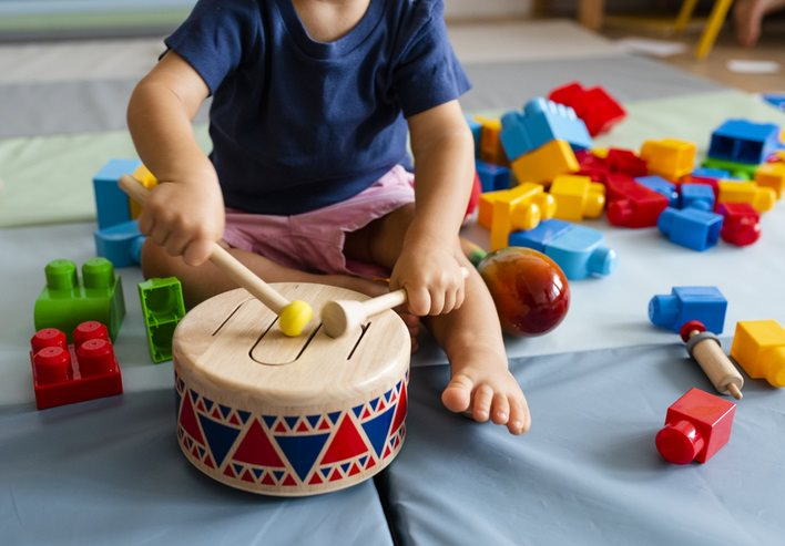 child playing the drums.